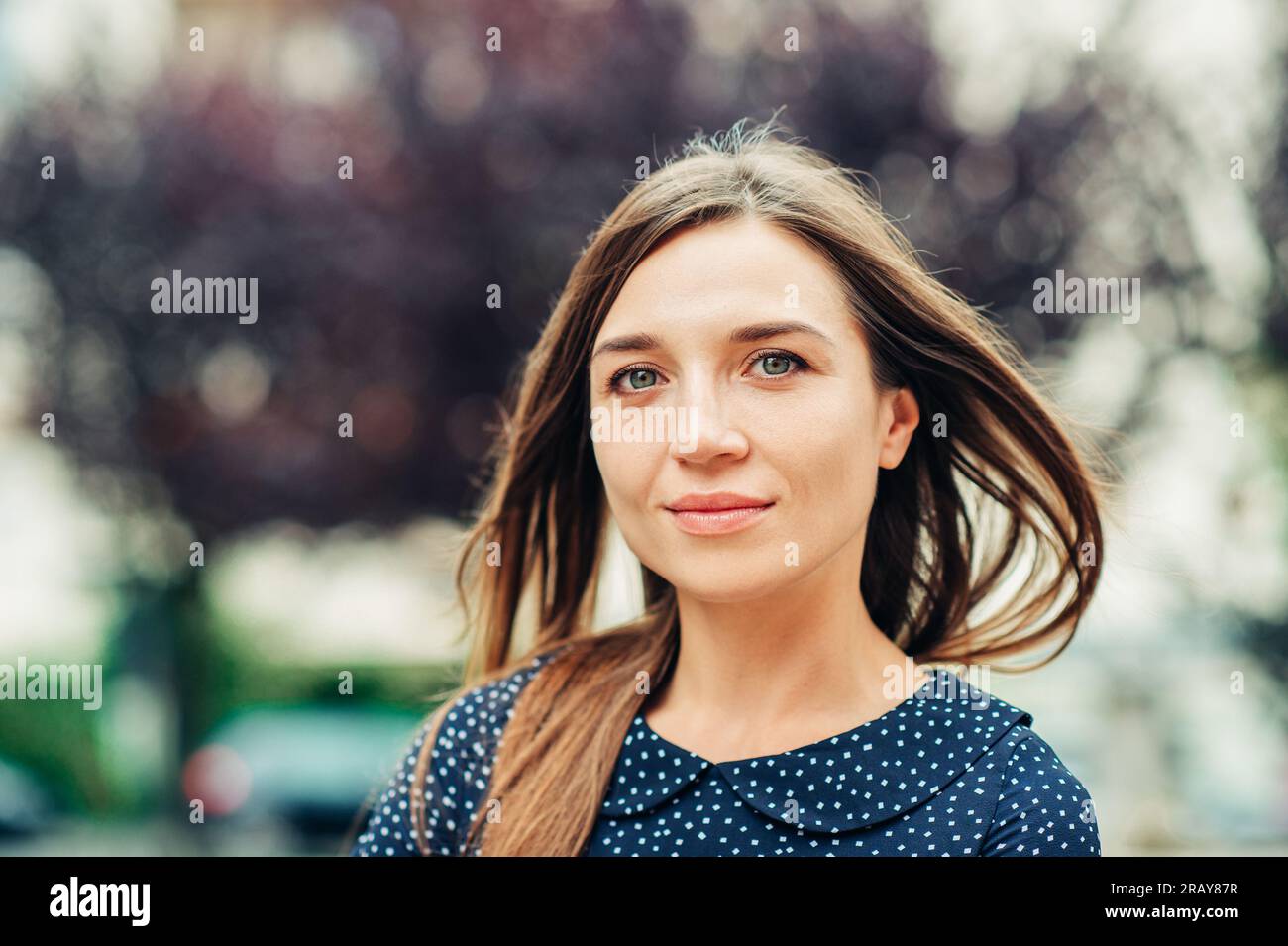 Outdoor portrait of attractive young woman with long brown hair Stock ...