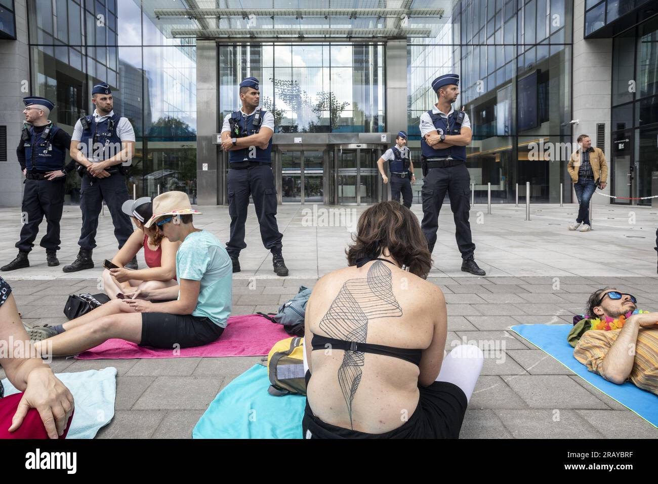 Illustration picture shows a protest action 'Engie-aan-Zee - Engie-les-Bains' (Engie by the Sea) in front of the headquarters of Engie Electrabel, part of the 'Code Red' protest actions in Brussels, Thursday 06 July 2023. A coalition of activists and trade unionists has taken several actions under the banner of 'Code Red' (Code Rouge - Code Rood) to denounce the 3.4 billion in dividends that Engie will pay to its shareholders for 2022, while energy poverty rises, prices remain too high and while the extended social rate for the RVT status expired on 1 July. BELGA PHOTO HATIM KAGHAT Stock Photo