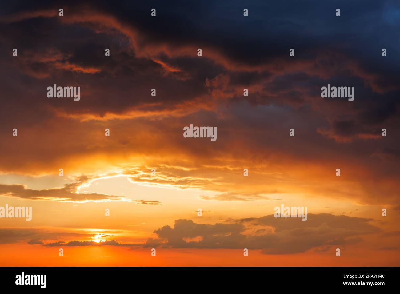 Dramatic sky with storm clouds during sunset. Summer stormy weather Stock Photo