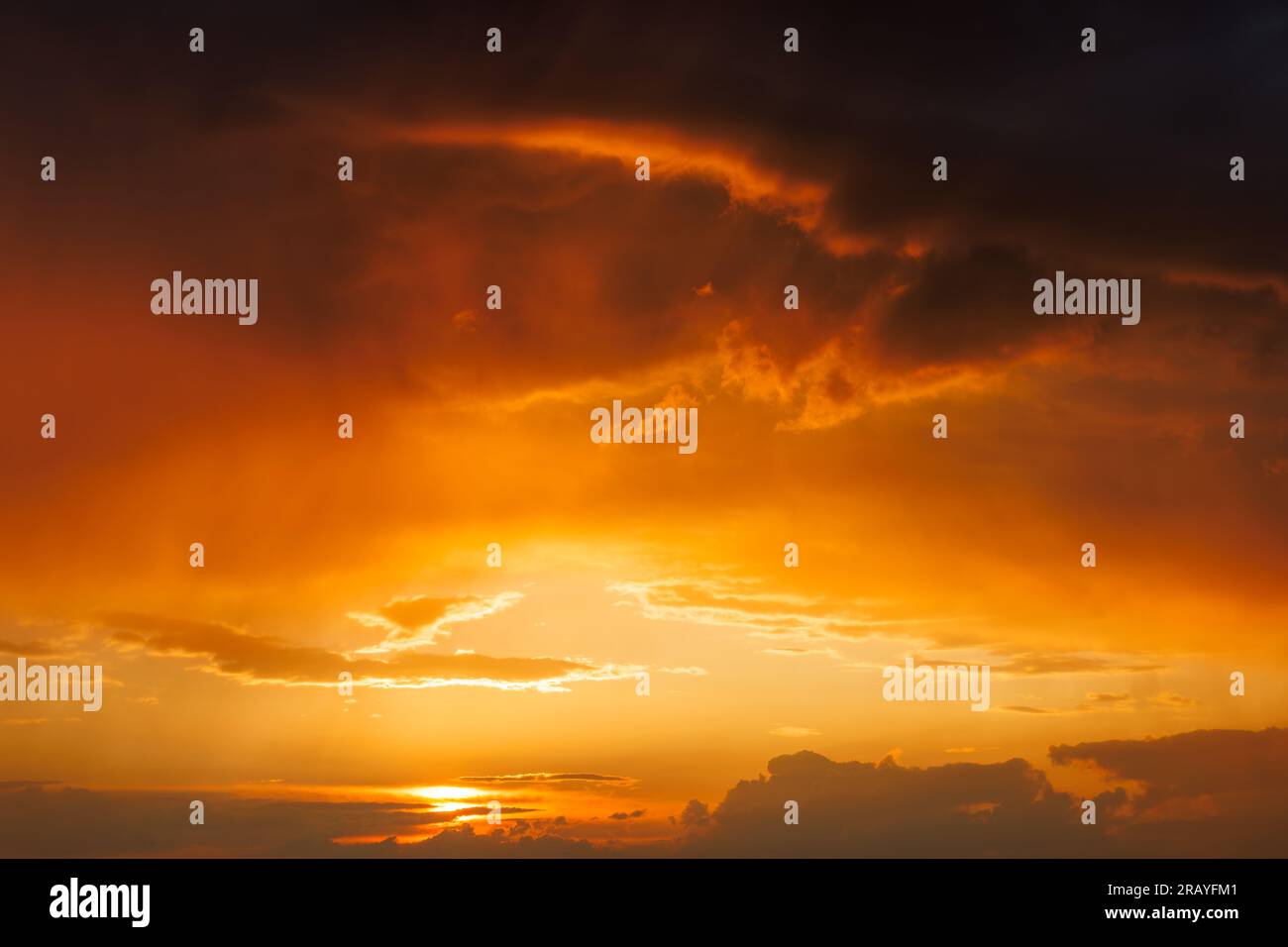 Dramatic sky with storm clouds during sunset. Summer stormy weather Stock Photo