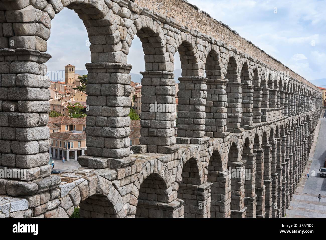 Roman aqueduct, detail of the stone arches of the magnificent 1st Century AD Roman aqueduct spanning the centre of the city of Segovia, Spain Stock Photo