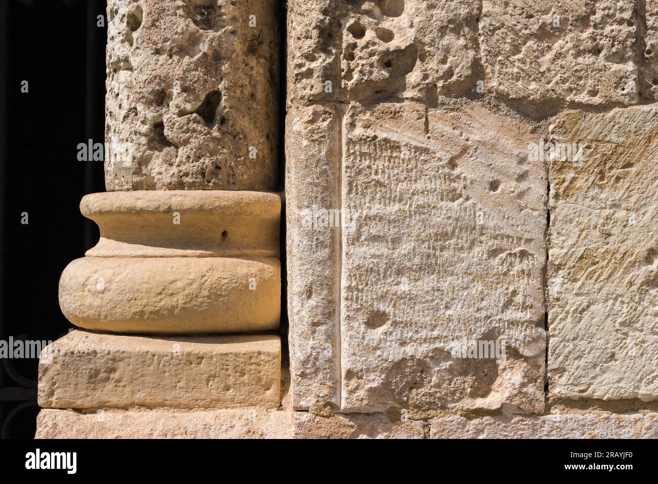 Medieval stone masonry, detail of the medieval stonework of the Iglesia de San Millan, a 12th Century Romanesque church in the city of Segovia, Spain. Stock Photo