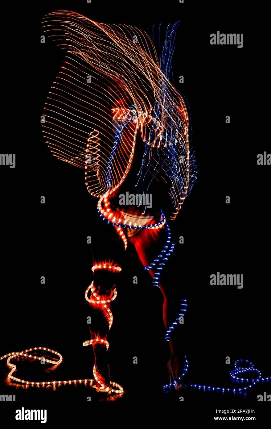 Woman wrapped in lights movement Stock Photo Alamy