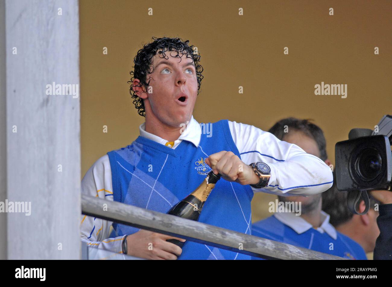 Rory McIlroy of Team Europe celebrates with champagne on the balcony of the clubhouse following Europe's victory in the 2010 Ryder Cup at the Celtic Manor Resort on October 4, 2010 in Newport,UK. Stock Photo