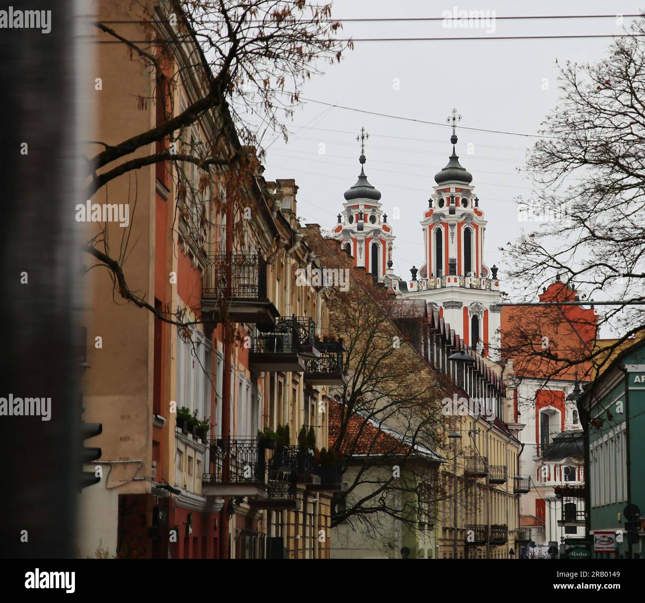 Towers of St Catherine's church in urban background in Vilnius, Lithuania Stock Photo