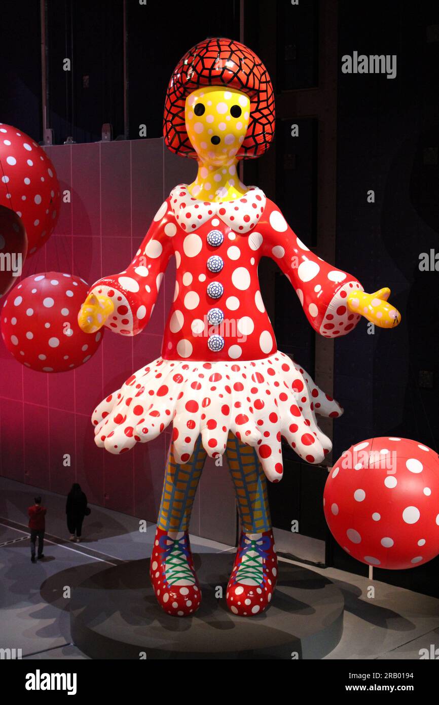 Giant doll made by Japanese artist Yayo Kusama wearing red and white spotted dress Stock Photo