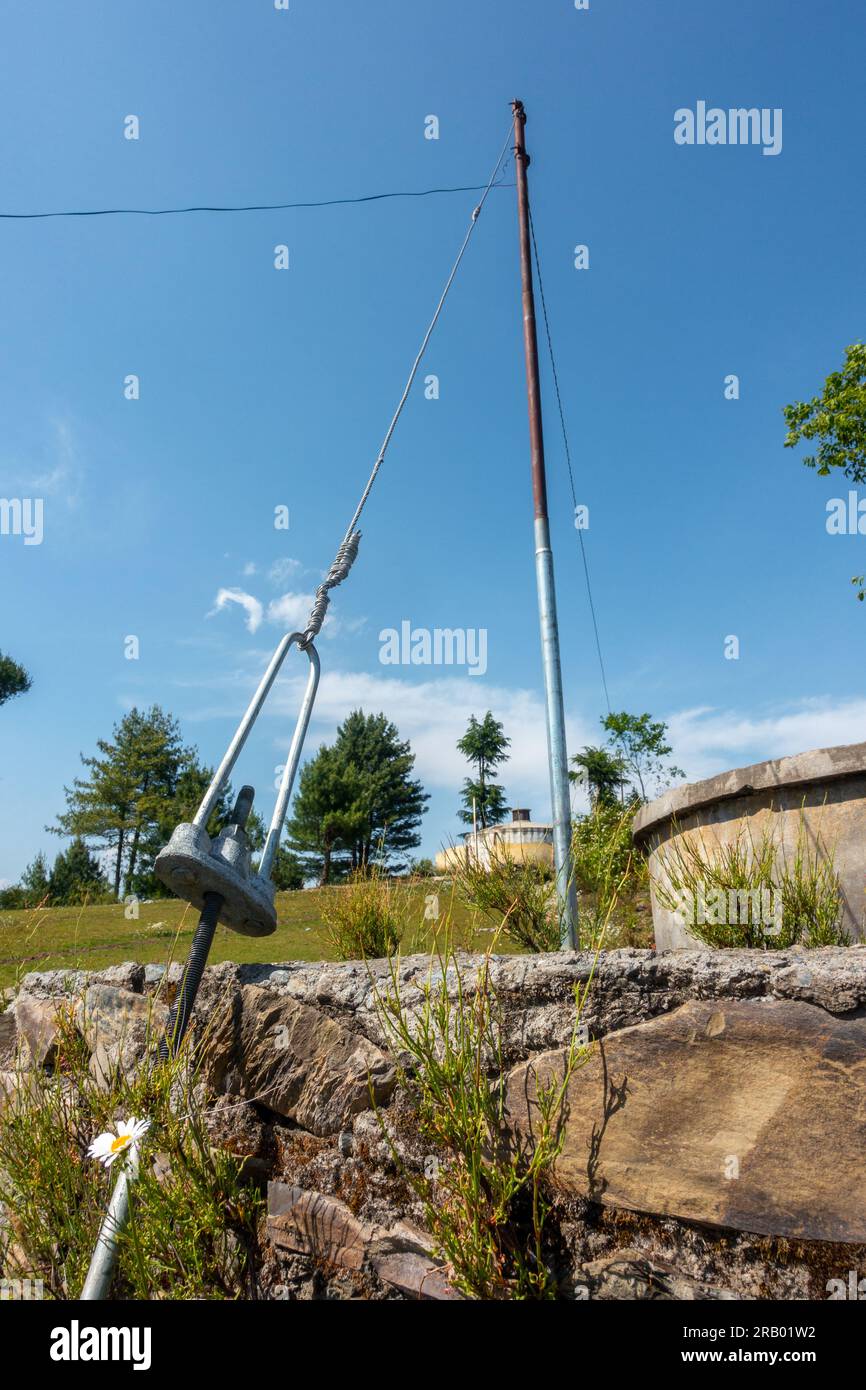 Ground wire of an electric pole. Rural area in Uttarakhand, India. Stock Photo