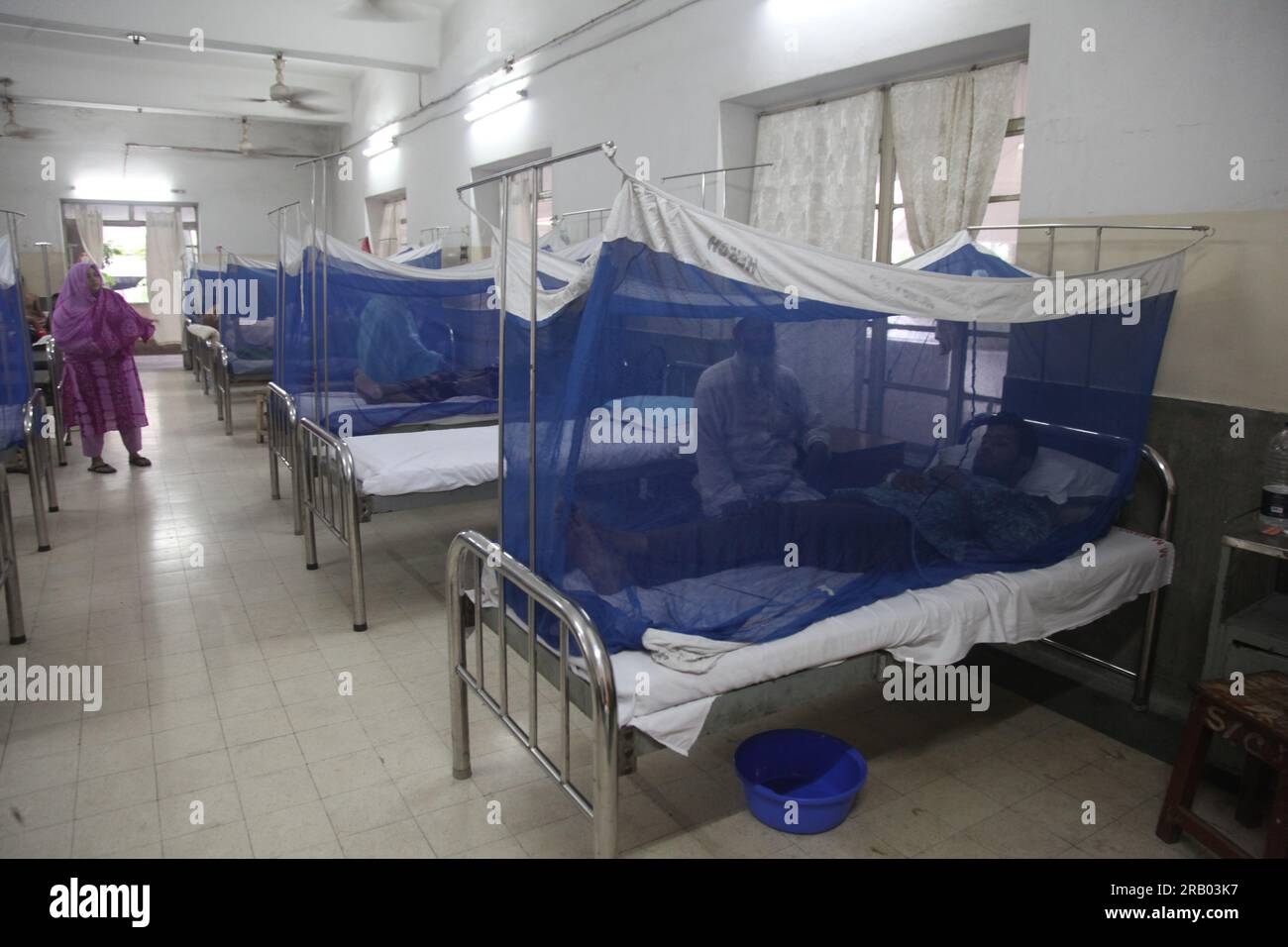 Dhaka Bangladesh 6july 2023.Bangladeshi dengue patients covered with a mosquito net suffers from dengue fever as they receive treatment inside Holy Fa Stock Photo