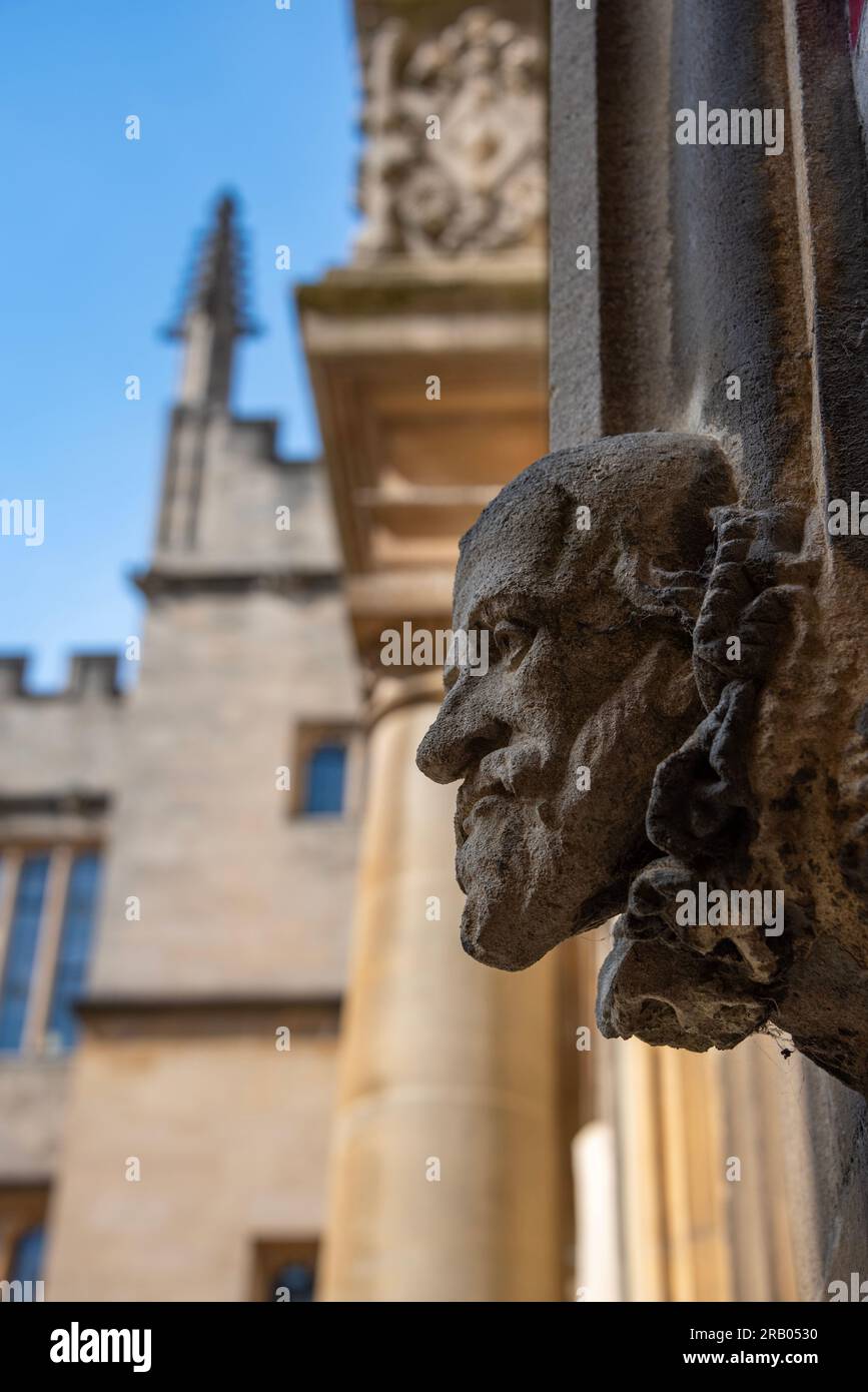 Ancient stone carved head, Old Bodleian Quad, Oxford Stock Photo