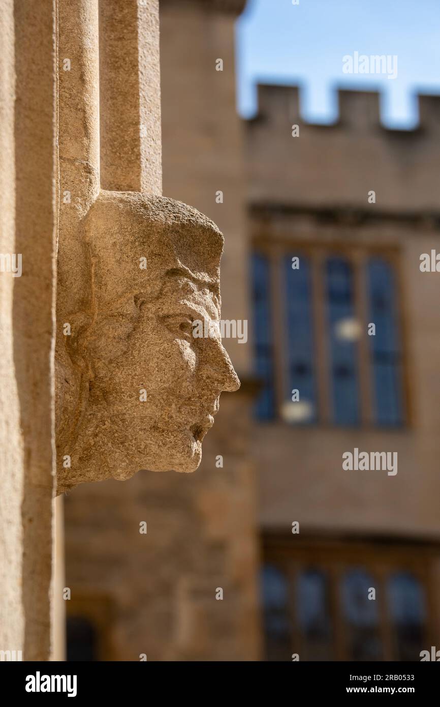 Ancient stone carved head, Old Bodleian Quad, Oxford Stock Photo
