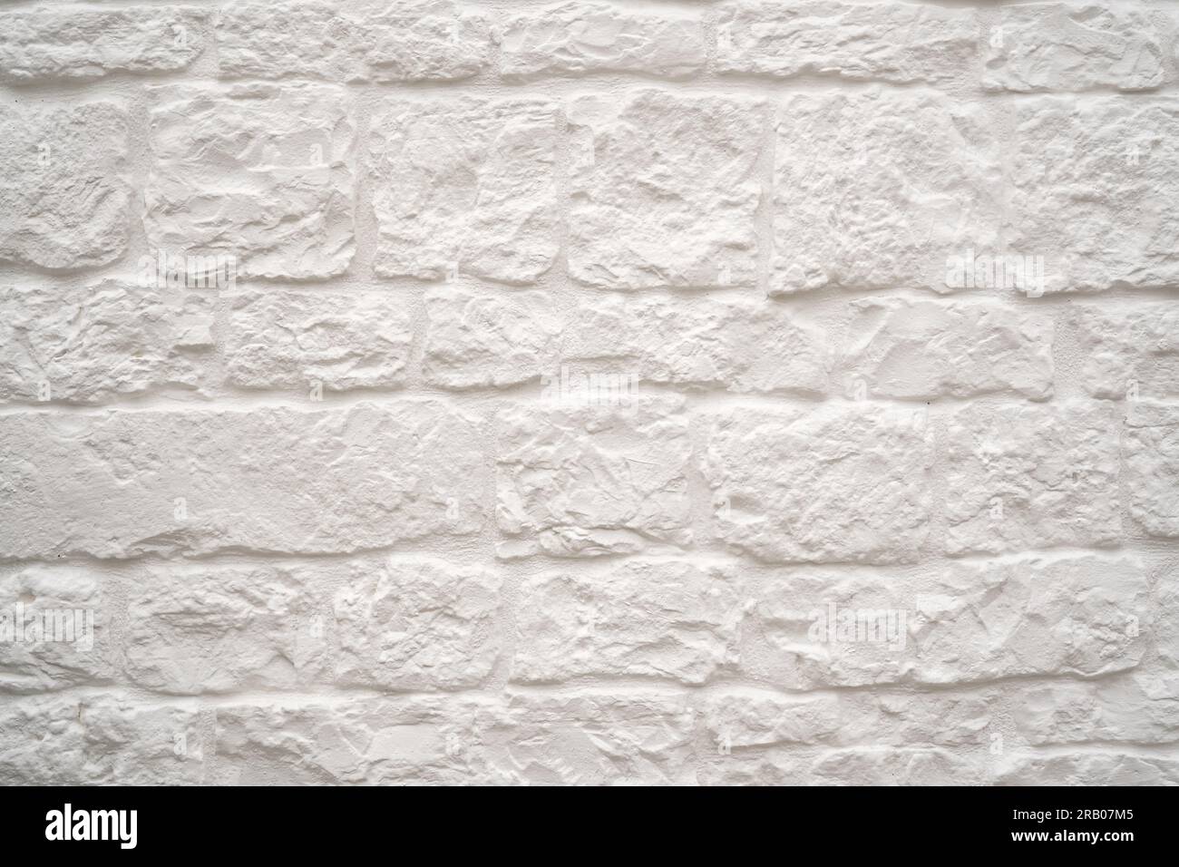 whitewashed stone wall background or texture Stock Photo