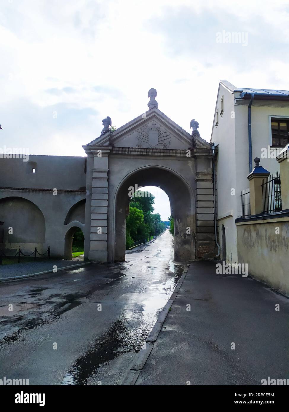 Glynska Gate of of the ancient castle in Zhovkva near Lviv in Ukraine on rainy day. Krakow gates located in the western part of the pentagon of the de Stock Photo