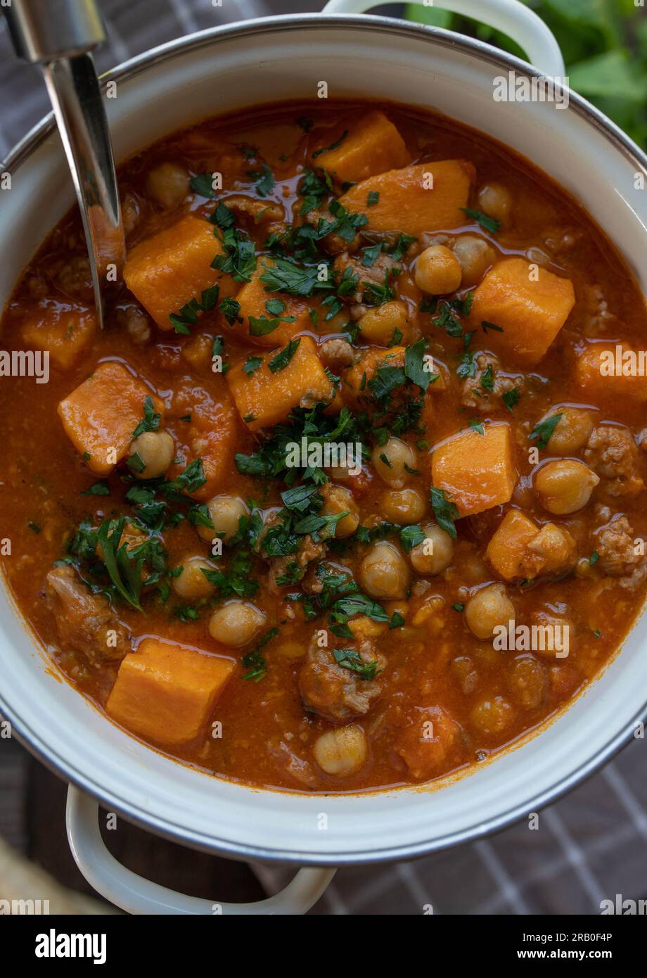 Stew with chickpeas, sweet potatoes and minced meat in a pot Stock Photo