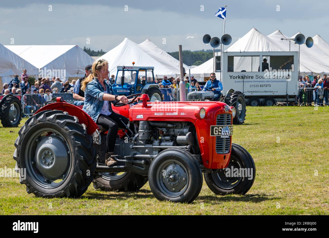 Woman driving vintage Massey Ferguson tractor, Haddington Agricutural Show, East Lothian, Scotland, UK Stock Photo
