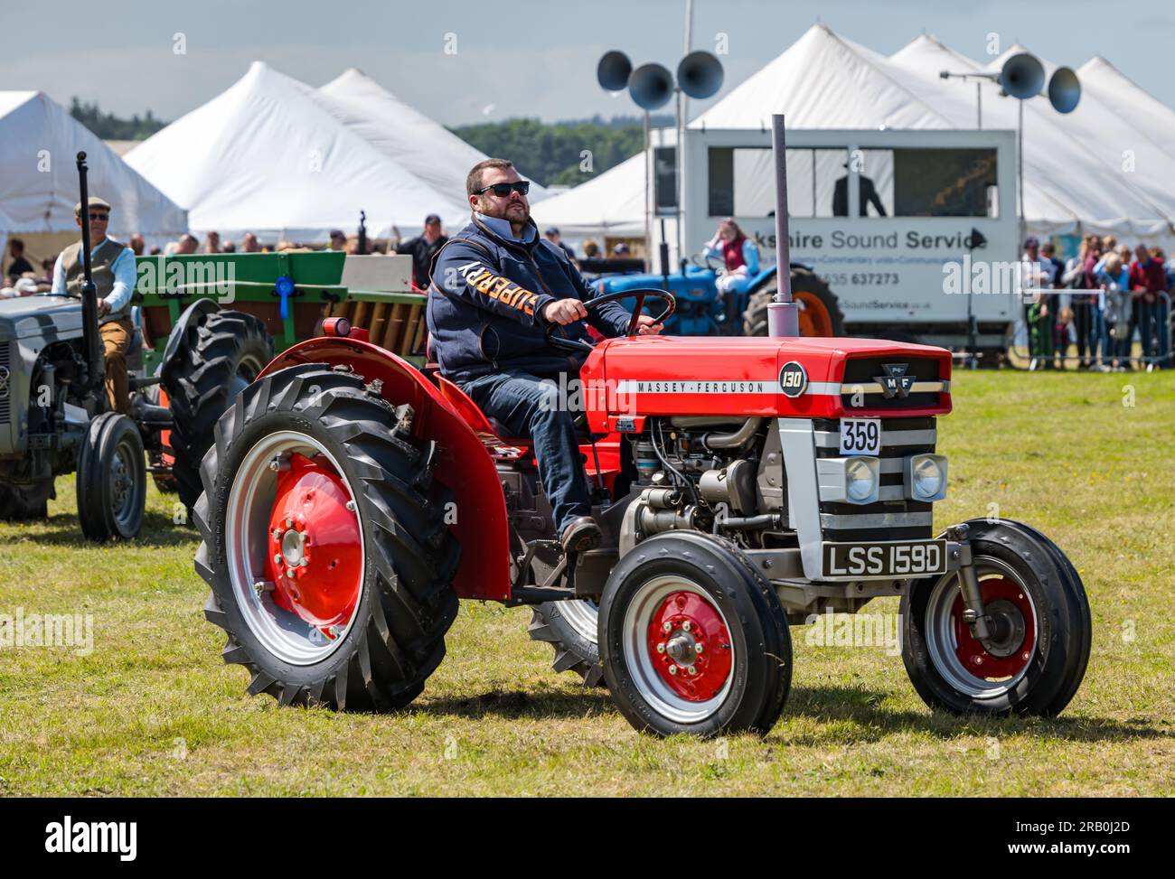 Man driving vintage Massey Ferguson tractor at Haddington Agricultural Show, East Lothian, Scotland, UK Stock Photo