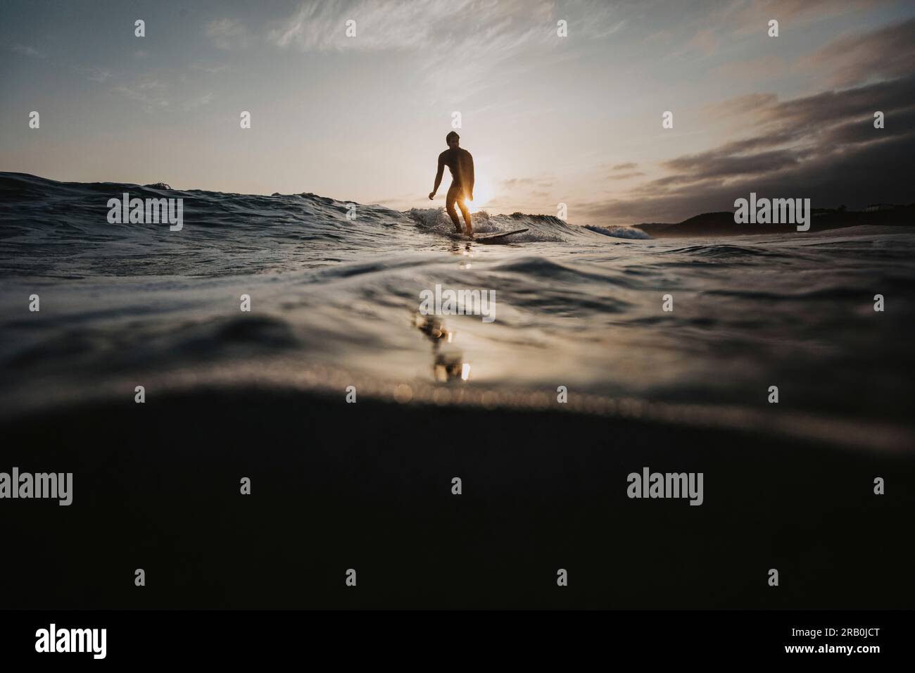 Surfer on wave hi-res stock photography and images - Alamy