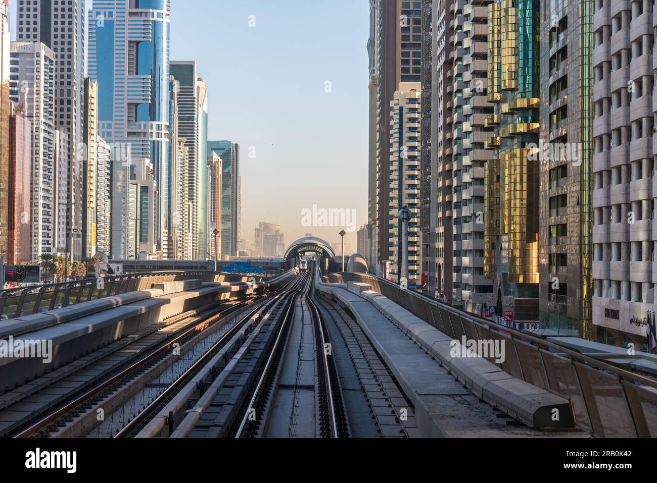 View of Dubai metro line with high sky buildings in UAE Stock Photo