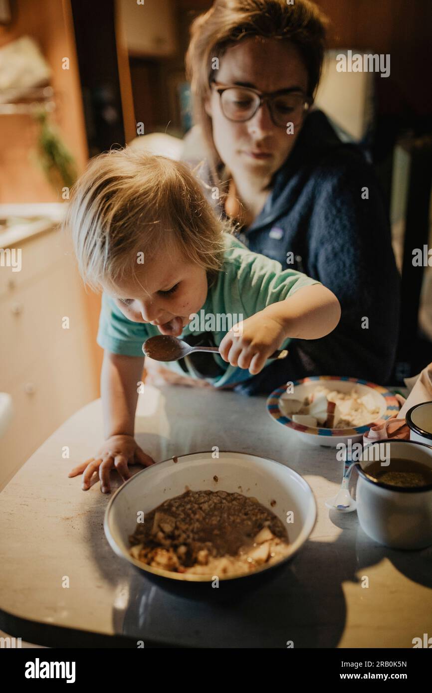 Family having breakfast in camper Stock Photo