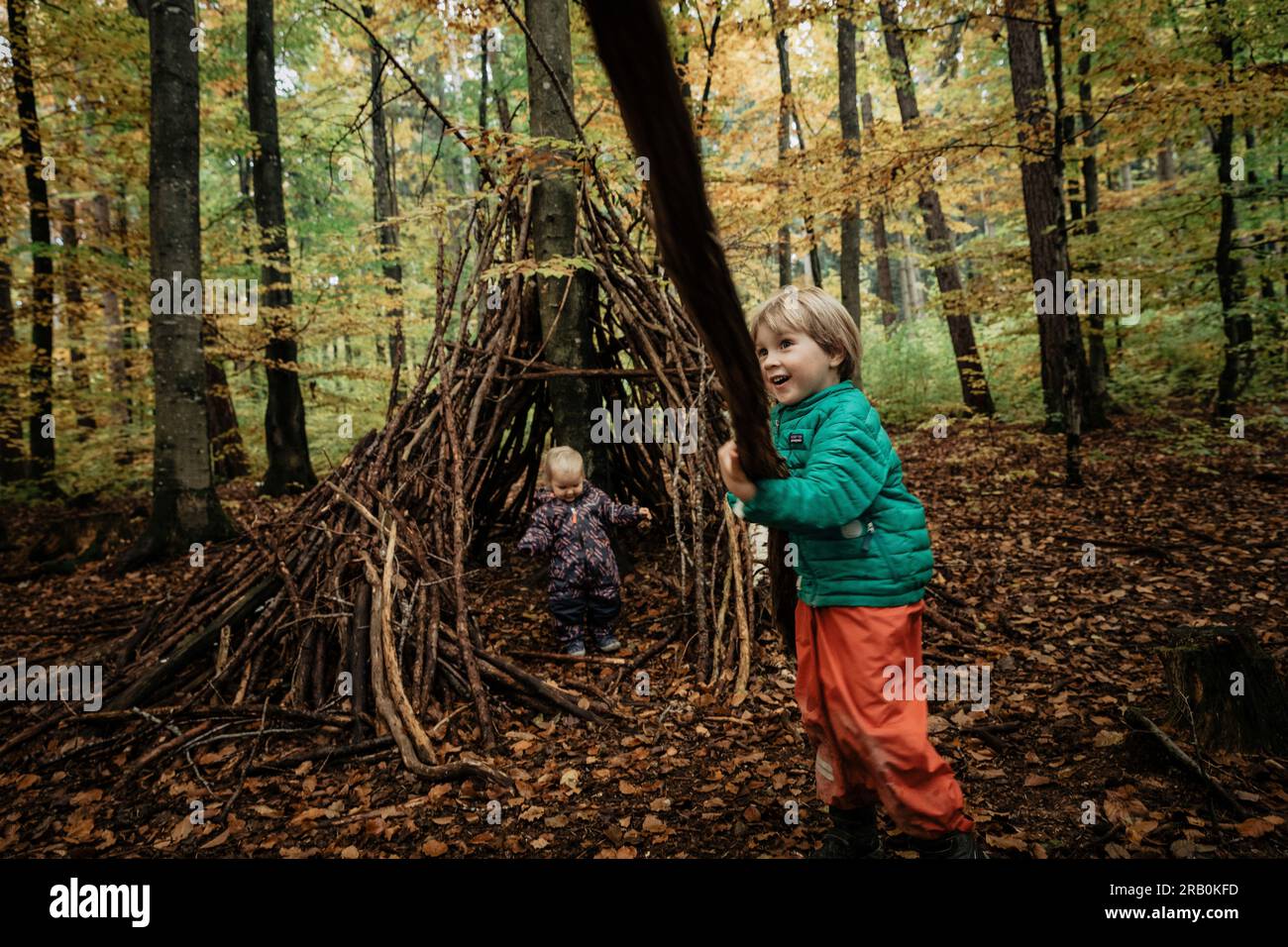 Brother and sister playing in the forest Stock Photo - Alamy