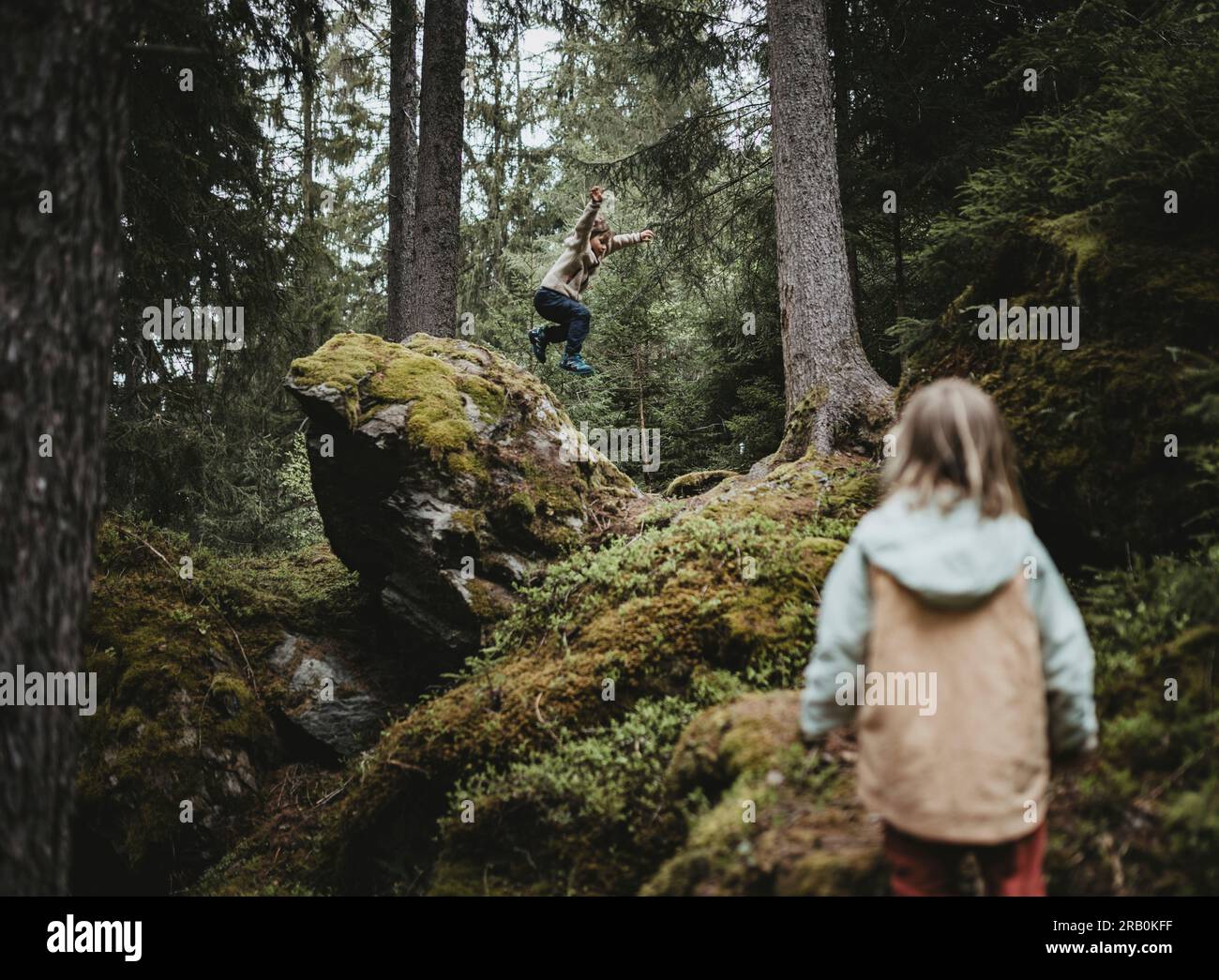 Brother and sister playing in the forest Stock Photo - Alamy
