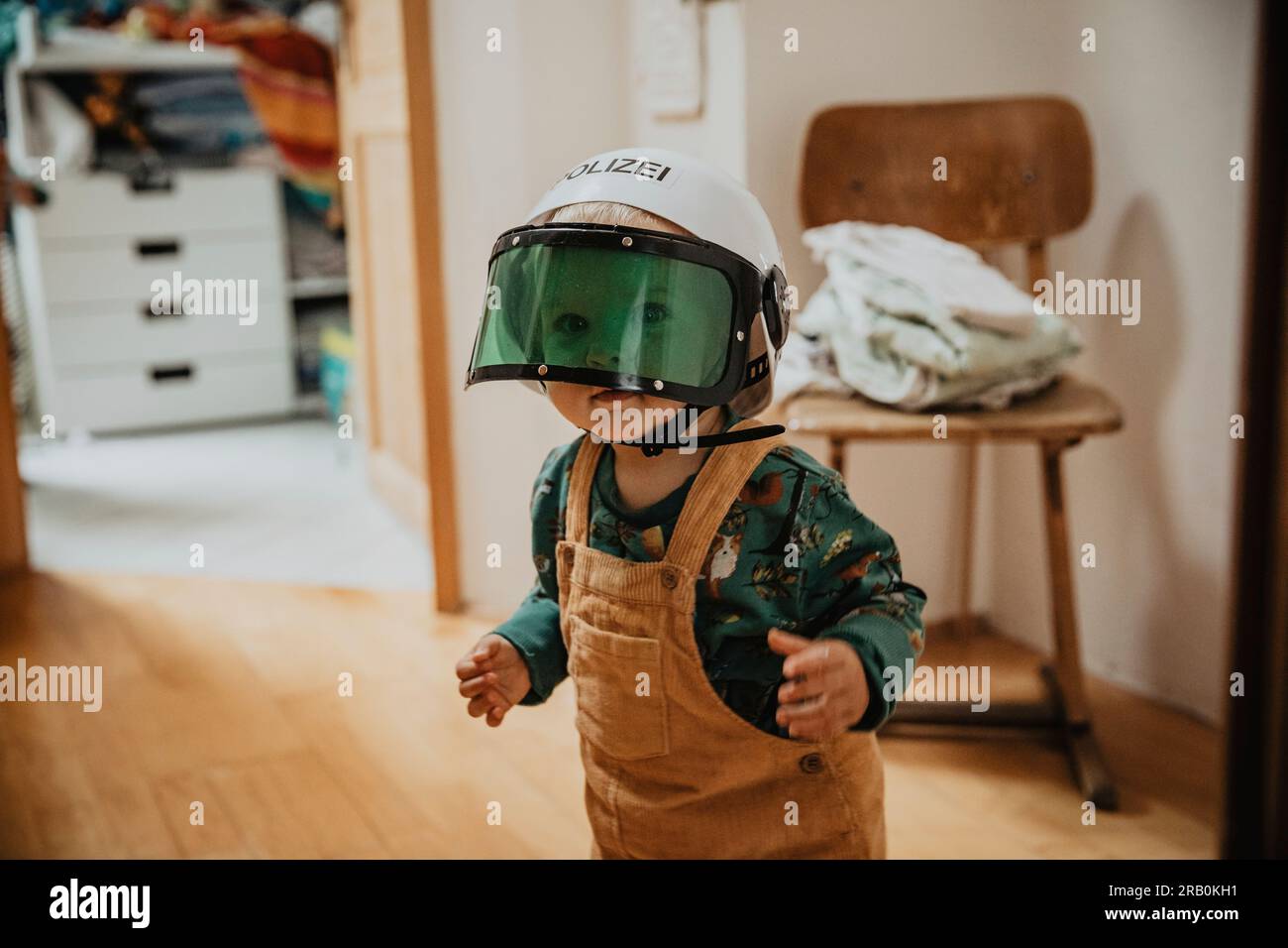 Little girl playing dress up Stock Photo - Alamy