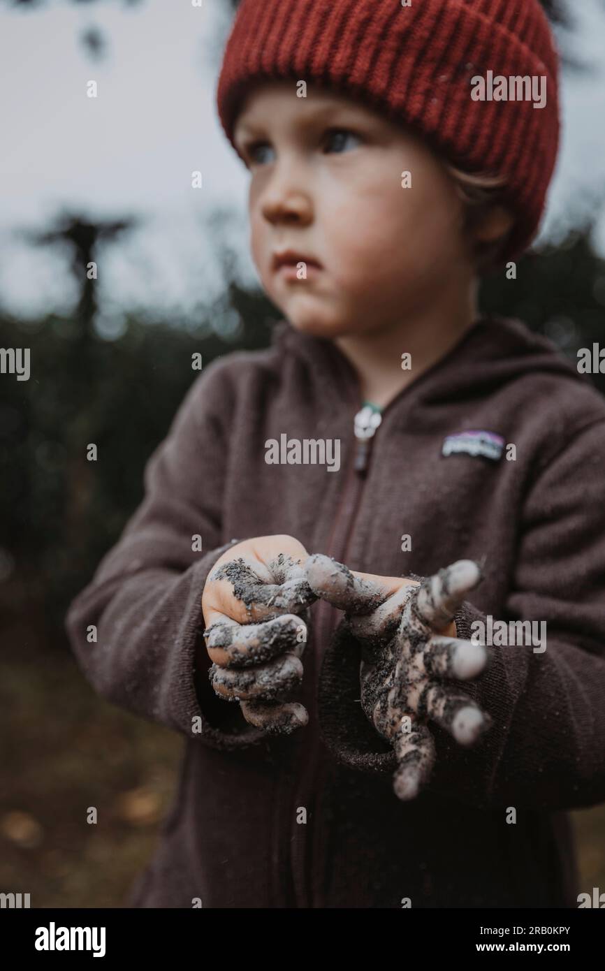 Boy with dirty hands Stock Photo