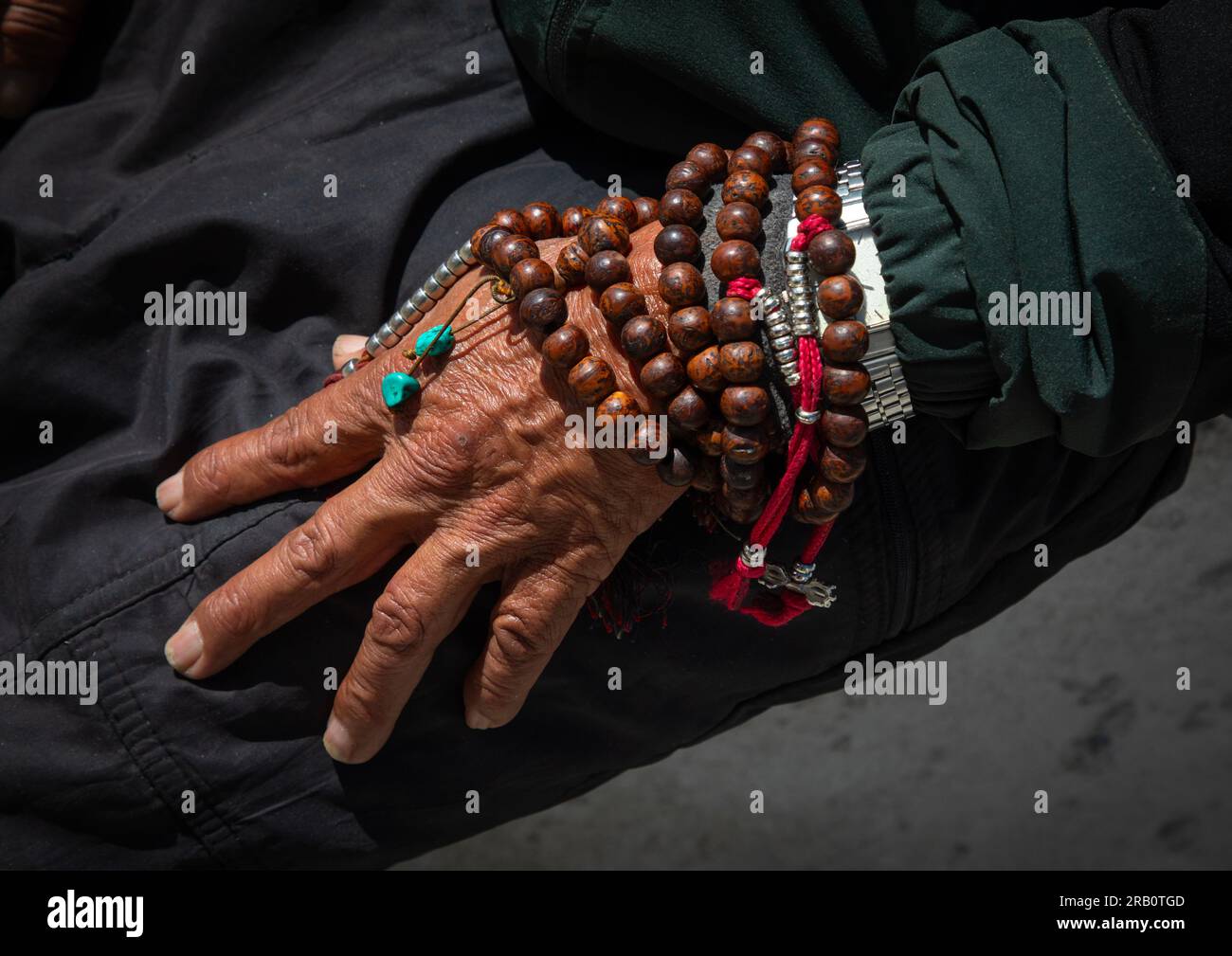 Buddhist hand with a payer beads, Ladakh, Leh, India Stock Photo