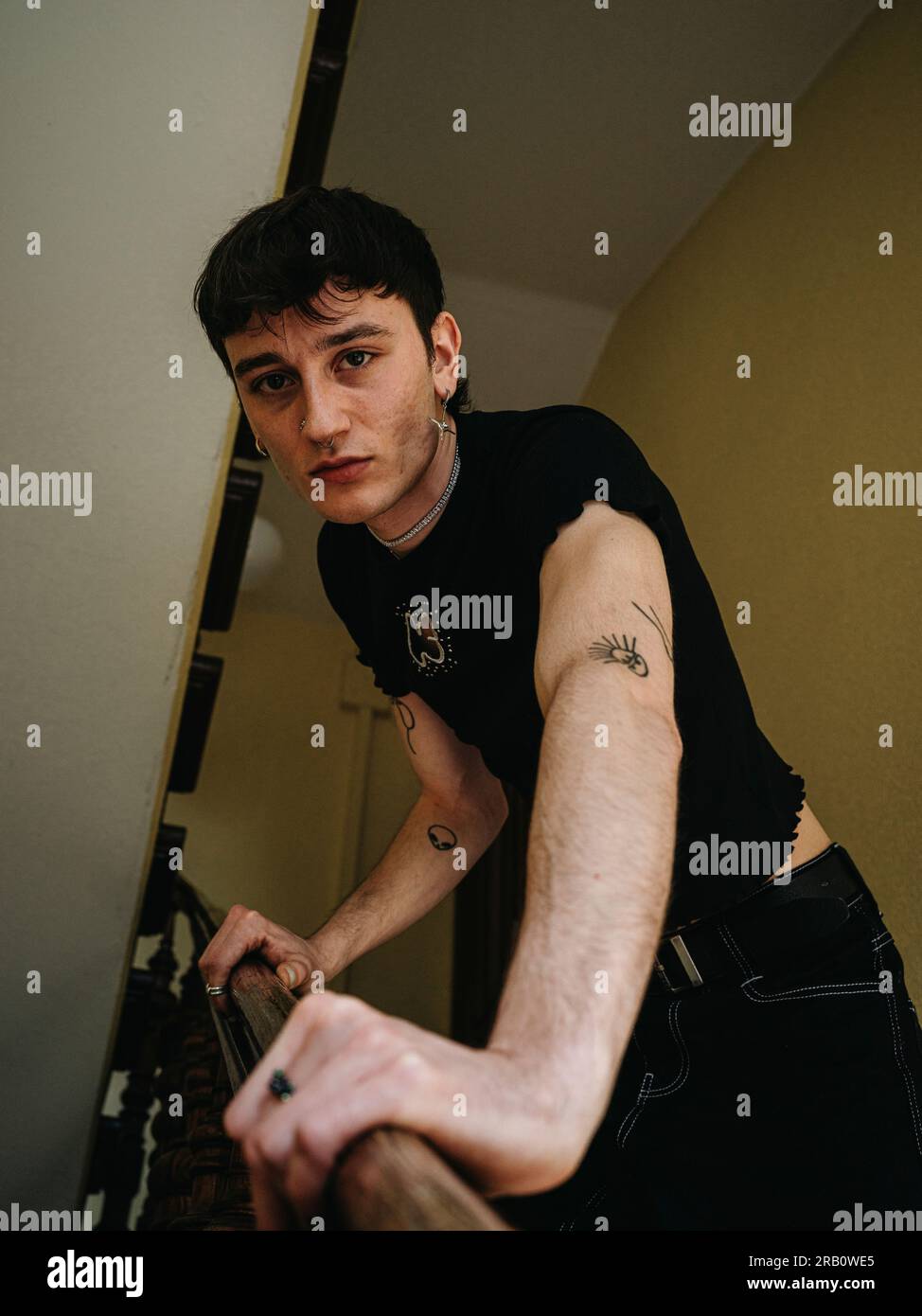 Nonbinary person in staircase Stock Photo Alamy