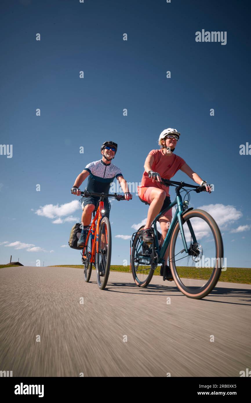 Couple, man and woman touring with bicycles, trekking bike, Stock Photo