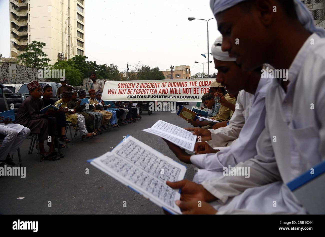 Hyderabad, Pakistan, July 6, 2023. Members of Fidaiyan-e-Khatm-e-Nabuwwat are reciting Quran as they are holding protest demonstration against desecration of Holy Quran in Sweden, at Karachi press club on Thursday, July 6, 2023. Stock Photo