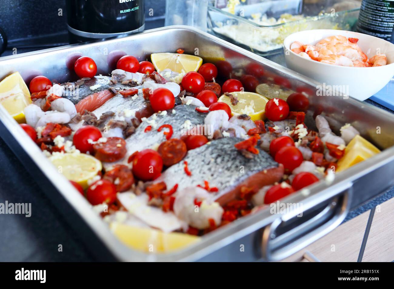 Salmon tray bake ready to put into the oven Stock Photo - Alamy