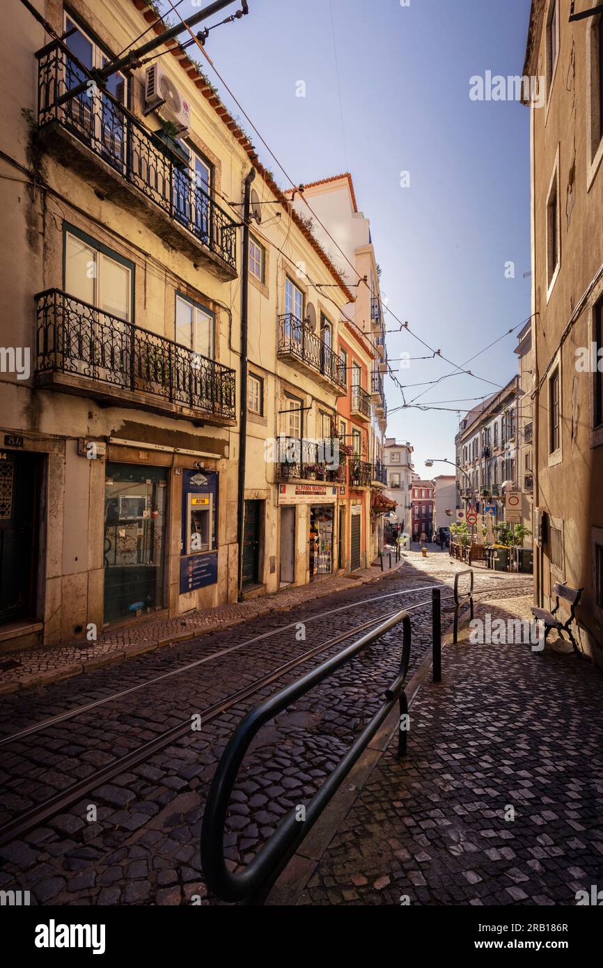 Narrow streets and old houses in the old town of Alfama, urban life in a city with historic buildings and lots of culture. Lisbon, Portugal Stock Photo