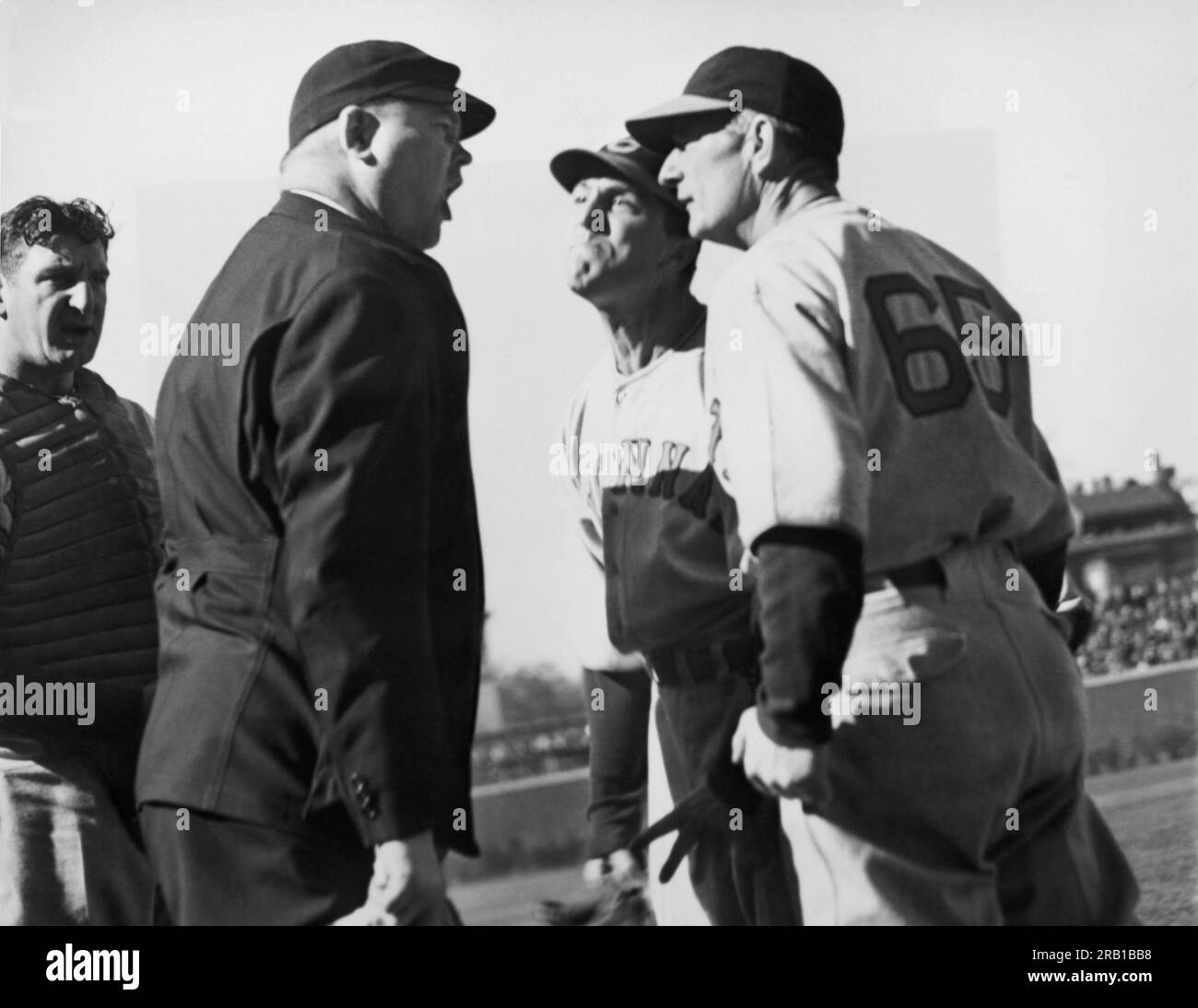 Chicago, Illinois:  April 30, 1938 At Wrigley Field, Umpire Magerkurth called it a ball, and Cincinnati Reds pitcher Joe Cascarella (center) says it was a strike with Reds manager Bill McKechnie joining in with Joe. Stock Photo