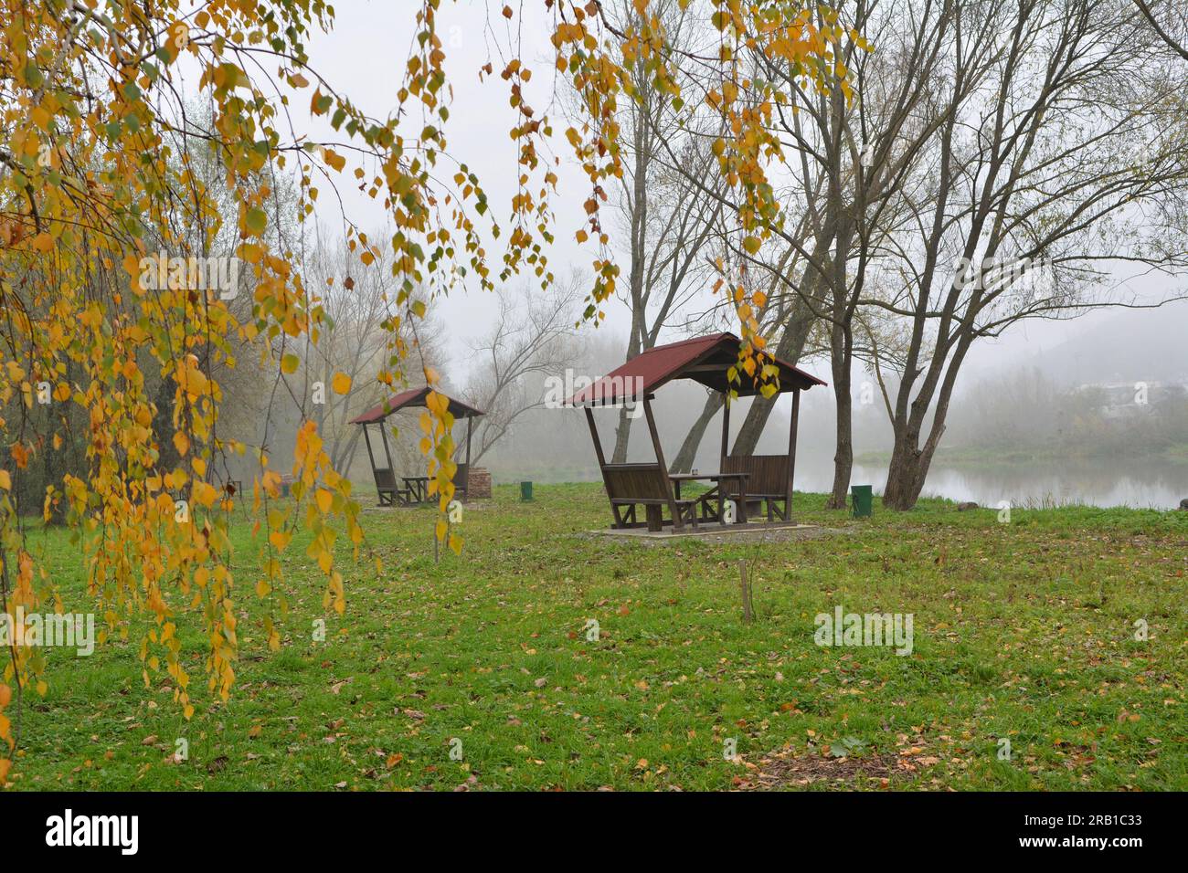 Wooden gazebo by the river in the autumn morning Stock Photo - Alamy