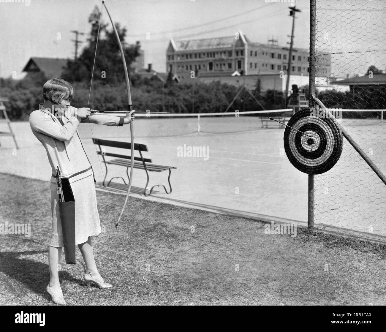 Hollywood, California:   1927 Actress Claire Windsor takes aim with a bow and arrow at the MGM lot. Stock Photo