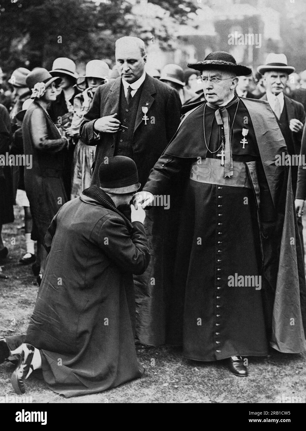 London, England c. 1934 A worshipper kissing the hand of Cardinal Bourne at St. Mary