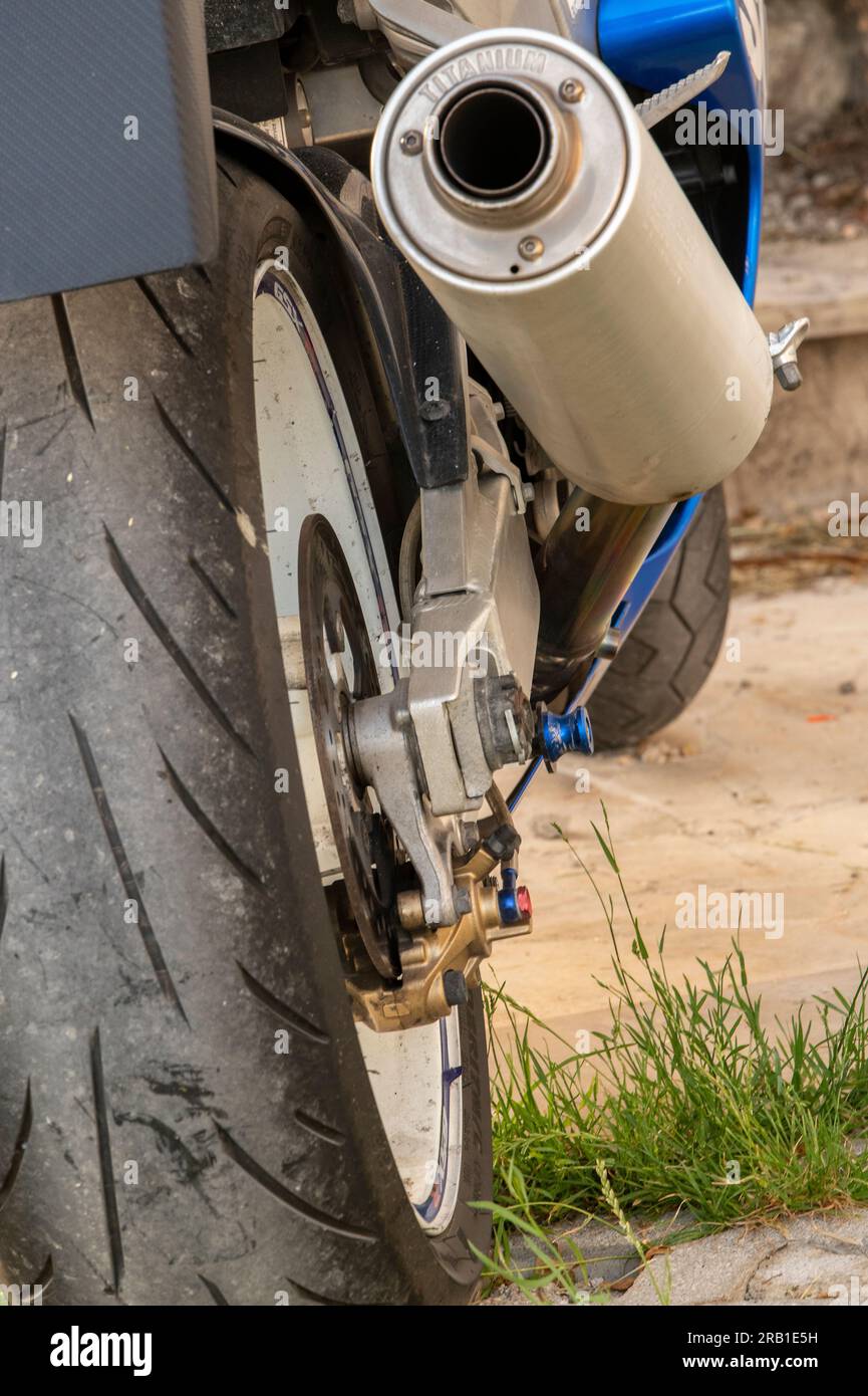 motorcycle exhaust pipe and slick tyre, fast motorcycle, racing