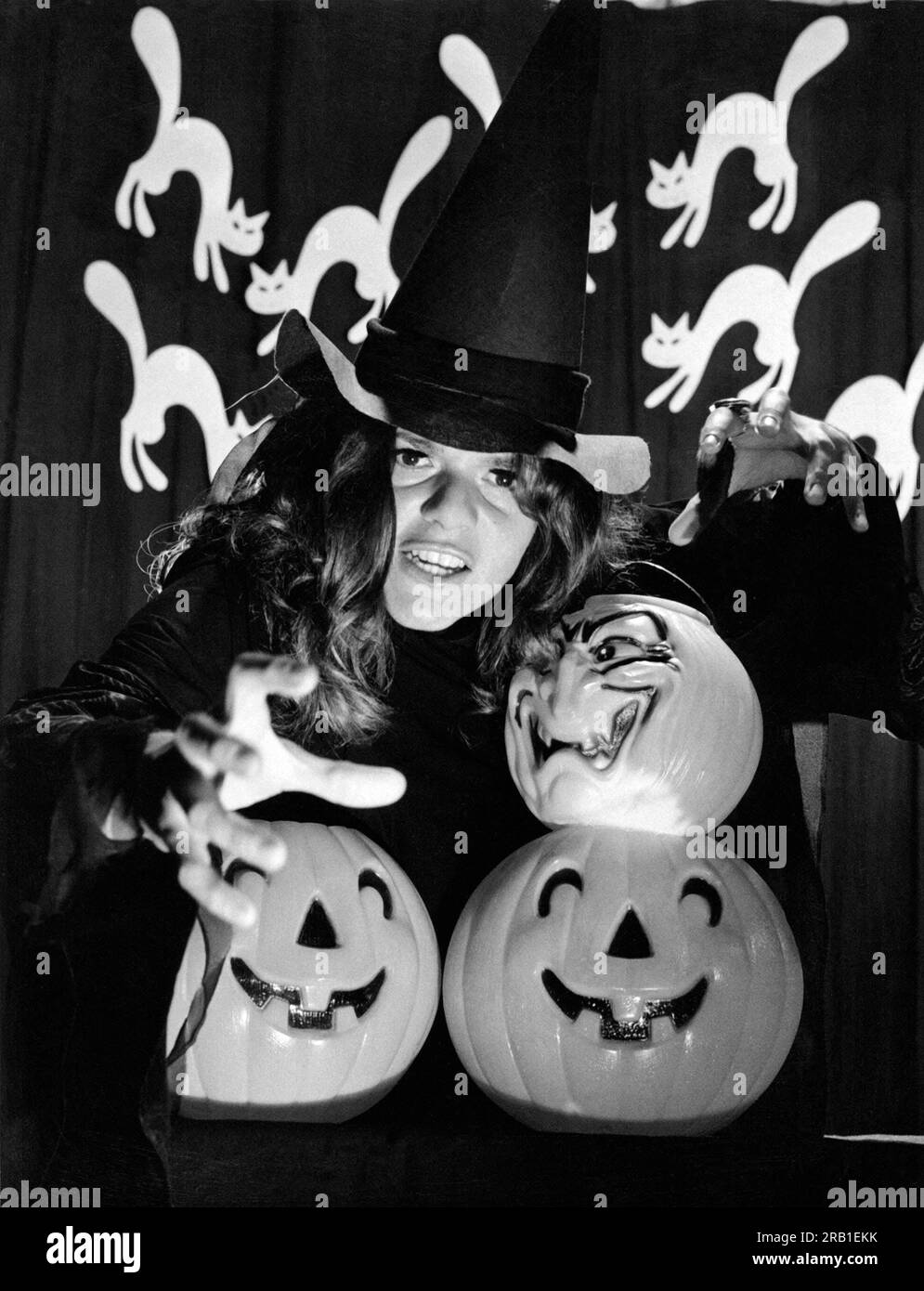 New York, New York:  1970 CBS television actress Drinda La Lumia gets into the spirit of Halloween with cats and pumpkins. Stock Photo