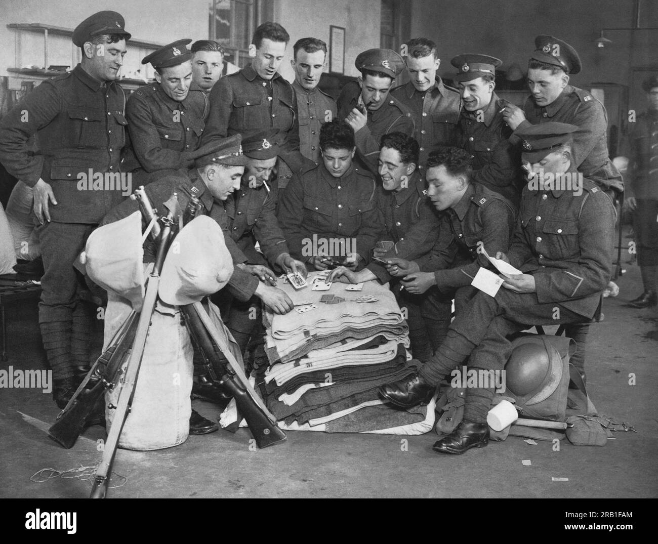 Portsmouth, England:  c. 1927 A group of British Marines playing a game of cards while waiting to ship off for duty in China. Stock Photo