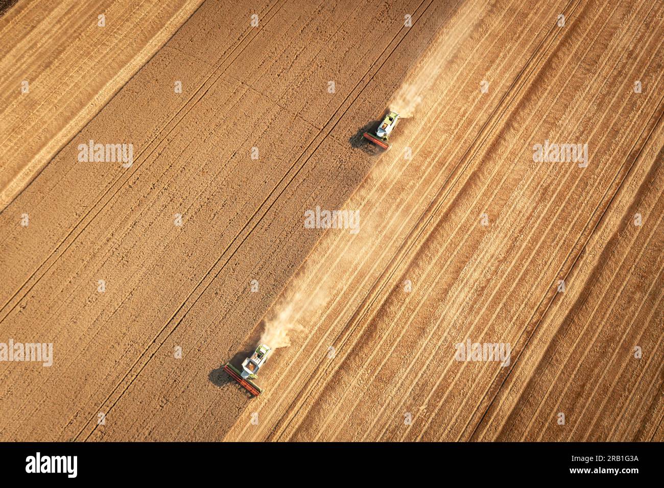 Aerial view combine harvester harvesting on the field Stock Photo - Alamy