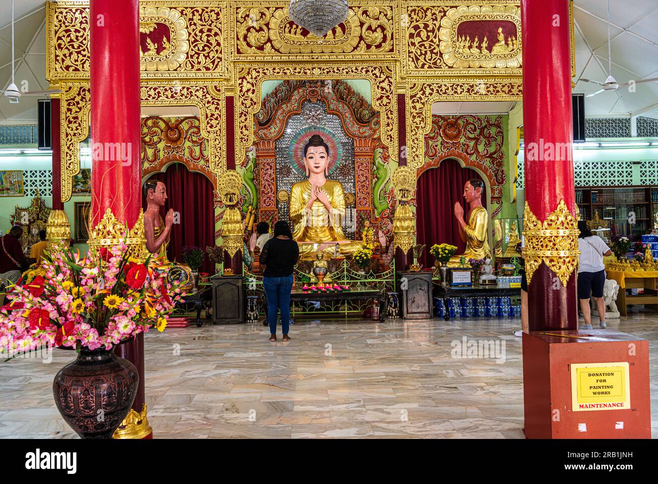 Georgetown, Penang, Malaysia--April 1, 2023. A horizontal shot of a golden Buddha statue in a Penang temple. Stock Photo