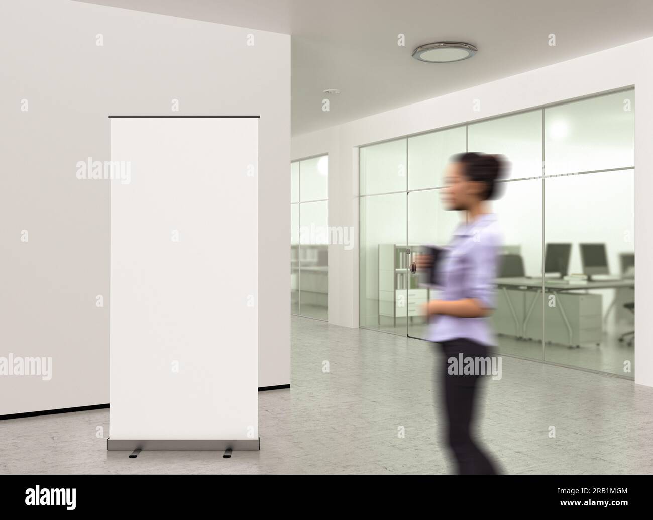 Blank roll up banner stand in modern office Stock Photo - Alamy