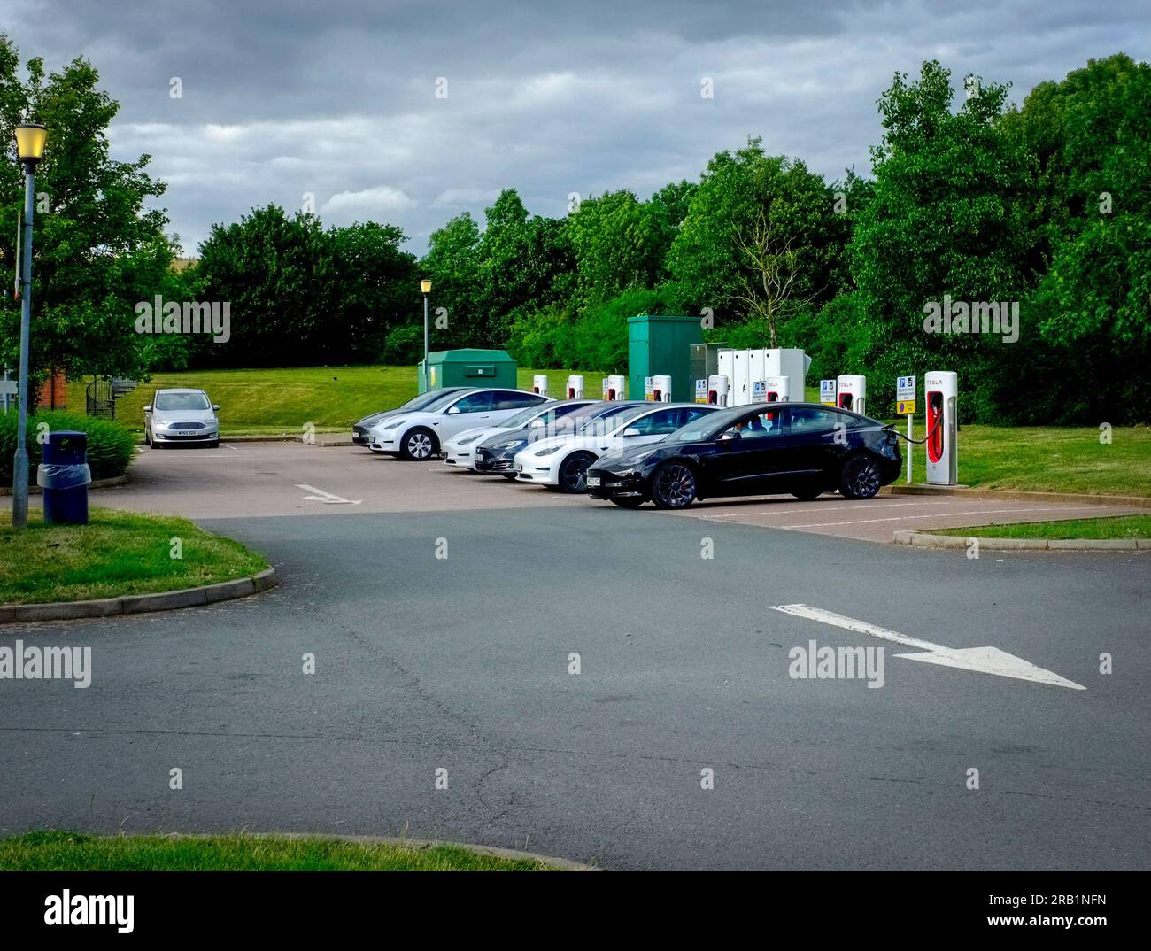 Tesla cars parked at a motorway service station at the Tesla charging