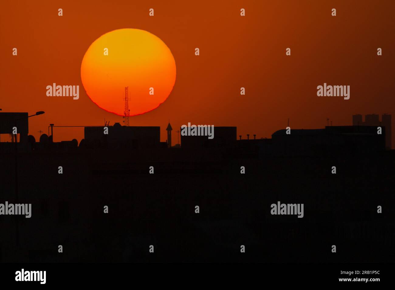 Sunset over the city, Silhouette of a building. Stock Photo