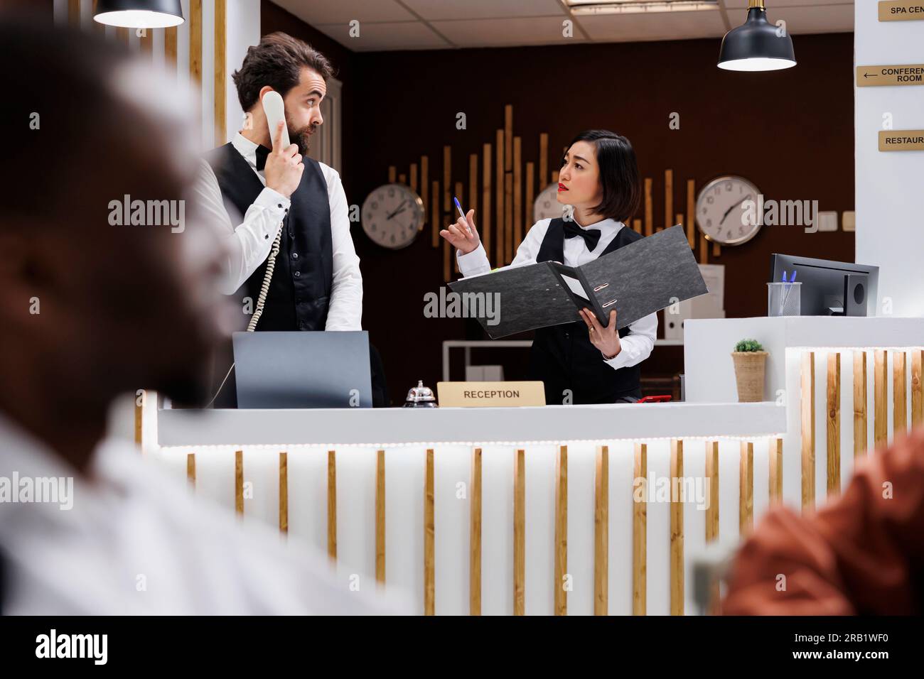 Hotel staff welcoming guests hi-res stock photography and images - Alamy