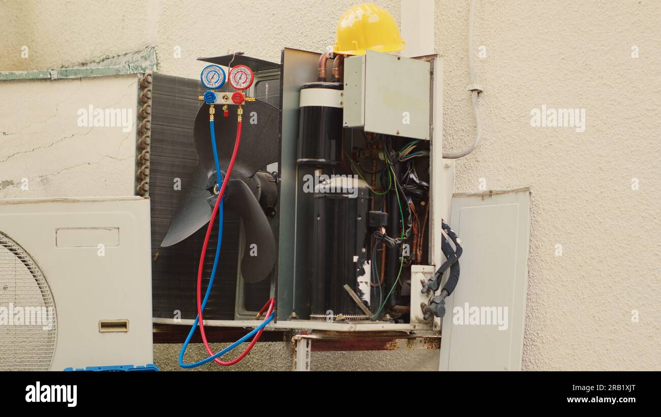 Tilt up shot of out of service condenser unit with protection cover