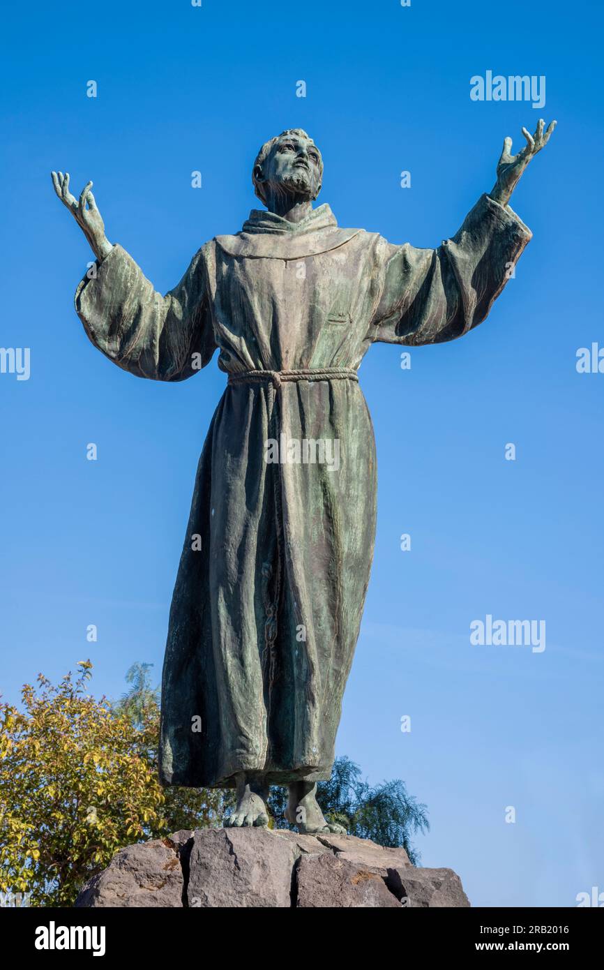 NAPLES, ITALY - APRIL 22, 2023: The bronze statue of St. Francis of Assisi near the church Basilica dell'Incoronata Madre del Buon Consiglio from 20. Stock Photo