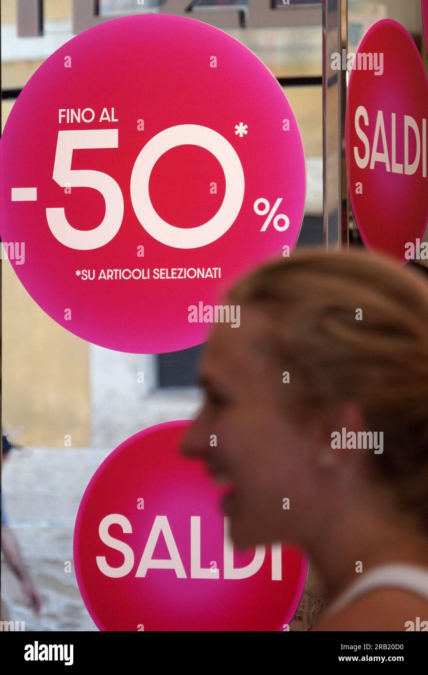 Rome, Italy. 6th July, 2023. Discount signs are seen at a store in Rome