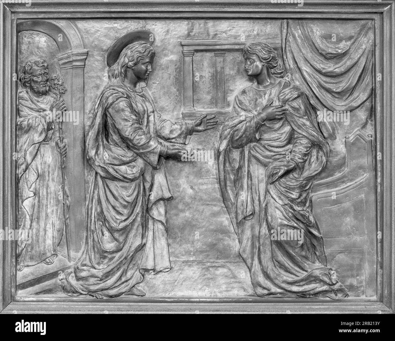 Title: NAPLES, ITALY - APRIL 22, 2023: The bronze relief of Visitiation on the gate of church Basilica dell Incoronata Madre del Buon Consiglio Stock Photo