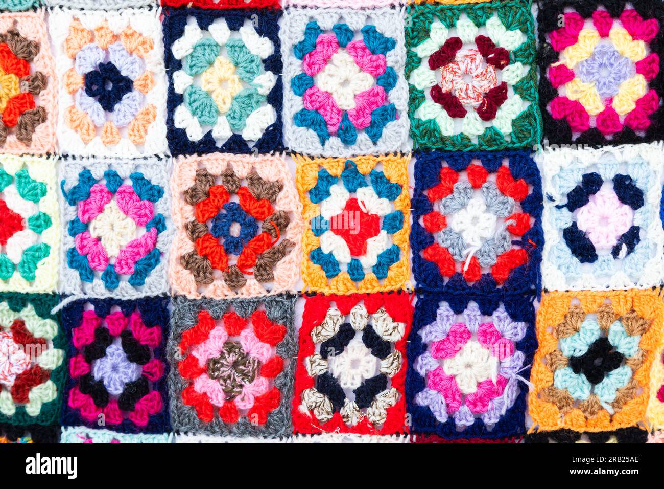 Multi colored blanket in wool, geometric background, retro decorative pattern Stock Photo